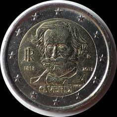 an old coin with a man's face on the front, and stars around it