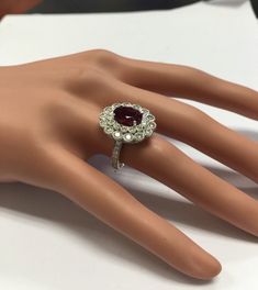 4.25 Carats Natural Very Nice Looking Tourmaline and Diamond 14K Solid White Gold Ring Suggested Replacement Value: $8,300.00 Total Natural Oval Cut Tourmaline Weight is: 2.50 Carats Natural Round Diamonds Weight: 1.75 Carats (color G-H / Clarity SI1-SI2) Ring total weight: 7.5 grams Disclaimer: all weights, measurements and colors are approximate and may vary slightly from the listed dimensions or as seen in the image. All pictures are magnified to show the smallest of details. Please, refer to Formal Ruby Gemstones, Platinum Ruby Ring With 17 Jewels, Formal Multi-stone Gemstones, Luxury Tourmaline Jewelry With Halo Setting, Luxury Ruby Cluster Ring With Center Stone, Luxury Cluster Ruby Ring With Center Stone, Fine Jewelry Tourmaline With Brilliant Cut, Formal Platinum Ruby Ring With Center Stone, Formal Ruby Ring With Platinum Center Stone