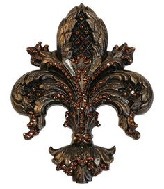 an ornate fleur de lis wall decoration