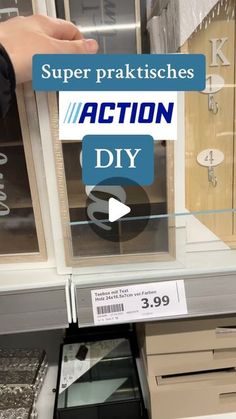 a person is holding an item in front of a store window with the words action diy on it