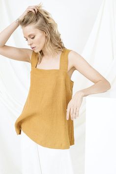 Minimalist Blouse, Linen Tank Top, Backless TopD E S C R I P T I O N• Relaxed fit• Square neckline• SleevelessD E T A I L S• Name: PAULA• Sizes: XS - XXL• 100% European soft and washed linen fabric (weight 206 g/m² | 6.49 oz/yd²). Fabric is woven according to universally accepted quality requirements, which correspond to OEKO-TEX® Standard 100 certified.• Model (5'8" | 175cm and 5'7" | 172cm ) wearing Mustard in size S. Please choose another colour and size on the right.Y O U R - S P E C I A L - Summer Solid Sleeveless Blouse Tops, Plain Tops For Summer Daywear, Summer Beach Plain Tops, Solid Color Square Neck Top For Summer, Summer Square Neck Beach Tops, Square Neck Tops For Summer Daywear, Summer Square Neck Top For Beach, Summer Daywear Tops With Square Neck, Summer Square Neck Tops For Daywear