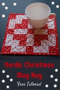 a red and white quilted placemat with a coffee cup on it that says nordic christmas mug rug