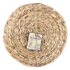 a round wicker basket is wrapped in twine