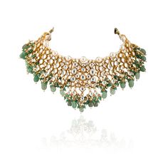 22kt Gold-plated necklace with floral hand crafted motifs, encrusted with white and green stones. Teamed with matching Jhumkas Matching Ring and Head Set Available from our Rings and Head Set Collection Composition: Silver Alloy and 22kt Gold Plated Care: Clean with soft dry cloth. Store in moisture free areas. Avoid storing in Velvet Boxes. Keep them away from liquid fragrances Delivery : 4 weeks as the product is hand crafted. For more information and sizes please contact fabiliciousfashion@gmail.com or visit our Copenhagen studio. Heavy Necklace, Necklace With Pearl, Traditional Indian Jewellery, Cloth Store, Bridal Necklace Set, Head Set, Indian Wedding Wear, Green Stones, Matching Ring