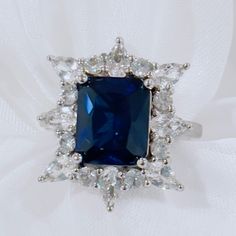 * September’s Birthstone * Dimensions- 0.77in L X 0.88in W * Band Width- 0.08 In * Material- Solid Sterling Silver * Carat Weight 4.68 Ctw * Gemstone Settingprong * Gemstone Shape - Rectangular Octagonal * Gemstone Composition- Lab Created Blue Sapphire Is Considered One Of The Big Three Crown Jewels In Royal Accessories Along With Ruby And Emerald. Blue Sapphire Ring With Square Cut, Blue Party Rings With Accent Stones, Formal Sapphire Ring With Gemstone Accents In Sterling Silver, Elegant Royal Blue Sapphire Ring With Center Stone, Dazzling Blue Sapphire Ring In Sterling Silver, Classic Blue Sapphire Ring With Gemstone Accents, Dazzling Blue Sapphire Sterling Silver Ring, Blue Cubic Zirconia Rings For Formal Occasions, Formal Blue Cubic Zirconia Ring