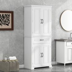 a bathroom with a sink, mirror and cabinet next to a toilet in the corner