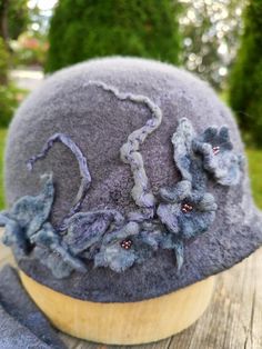 Elegant felt hat. Warm and cozy. 100% merenos wool. Decorated with flowers, Czech beads. The felt hat is not afraid of precipitation and holds its shape well. Size 56-57 Elegant felted hat. Warm and cozy. Decorated with flowers, Czech beads. 100% mereno wool. The felted hat is not afraid of precipitation and holds its shape well. Size 56-57 Handmade Cloche Hat With Curved Brim For Winter, Handmade Winter Felt Hat, One Size, Handmade Winter Felt Hat, Handmade Winter Felt Hat In One Size, Handmade Mini Hat With Curved Brim For Winter, Handmade Mini Winter Hat With Curved Brim, Whimsical Winter Hat With Short Brim, Handmade Wool Felt Hat For Winter, Handmade Winter Felt Hat With Curved Brim