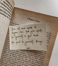 a piece of paper that has been placed on top of an open book with writing