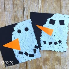 two snowmen made out of broken pieces of paper