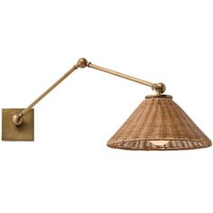 a wall light with a rattan shade on the side and a metal arm that is attached to it