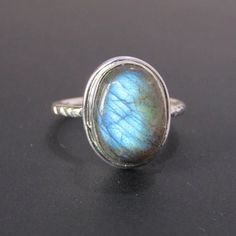 Natural Labradorite 925 Sterling Silver Ring - Natural Blue Fire Labradorite Cabochon Gemstone Ring - Oval Shape Stone - Engagement Ring.! We Also Accept Wholesale Or Orders And All Kinds Jewelry & Gemstones Re Available In Small And Bulk Quantity. For Any Query Please Contact Us. * All our jewelry is Micron Plated which is higher quality as compared to Standard Plating * Please note that there will be slight variations in stone texture and color shades in the actual product that you receive. Stone quality or grade will be same. Product Info  Gemstone -- Labradorite  Metal -- 925 Sterling Silver Stone Color - Blue  Band colour - Silver SHIPPING POLICY .After Receipt Of Payment, Ship Within 1-2 Business Days. .Delivery Will Take 14-21 Days .Speed Post Take 3-5 Days. .Contact For Fast Shippi Oval Labradorite Cabochon Jewelry, Oval Cabochon Labradorite Jewelry, Oval Labradorite Ring Stamped 925, Handmade Labradorite Oval Cabochon Ring, Oval Silver Labradorite Gemstones, Untreated Oval Silver Moonstone Ring, Oval Labradorite Jewelry Stamped 925, Oval Labradorite Gemstone Ring, Labradorite Gemstone Oval Ring