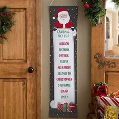 a christmas sign hanging on the wall next to a door