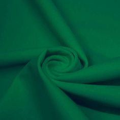 A swirled piece of microfiber nylon spandex in the color Cool Green Cool Green, Fashion District, Feeling Confident, Creative Direction, Eye Catching Colors, Blue Moon, Fabric Store, Spandex Fabric, Feel Confident