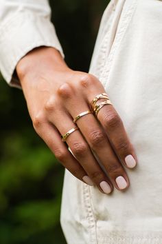 Details These solid 14k gold flat bands are twisted together and attached by a gold link. This ring can be engraved on the inside of the band with up to 8 characters. Measurements Width: 2mm - 6mm Shipping Each piece of jewelry is carefully hand fabricated in our NYC studio so please allow 2-3 weeks for delivery. If you would like to request a rush order please contact the studio at sophie@sophieratner.com. Selecting faster shipping options will not speed up the time it takes to make the jewelry Adjustable 14k Gold Midi Rings With Polished Finish, Hammered Open Ring For Promise, Dainty Hand Forged Gold Stackable Rings, Minimalist Gold Engraved Midi Rings, Minimalist Hand Forged Gold Midi Rings, Minimalist Engraved Gold Midi Rings, Gold Engraved 14k Gold Midi Rings, Gold 14k Engraved Midi Rings, Minimalist Polished Promise Band