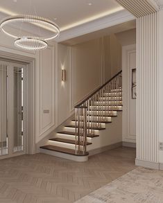 an elegant staircase with chandelier and wooden flooring in a white walled room