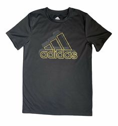 Adidas boys shiny active logo tee in black with gold logo size M(10/12). Excellent condition!! 100% polyester Sports Tops With Logo And Crew Neck, Athletic Fit Activewear With Logo Print And Short Sleeves, Athletic Fit Activewear With Logo Print, Sports Crew Neck Top With Logo, Sports Logo T-shirt In Athleisure Style, Short Sleeve Logo T-shirt In Athleisure Style, Casual Adidas T-shirt For Gym, Athleisure T-shirt With Sports Logo, Black Athleisure Tops With Logo