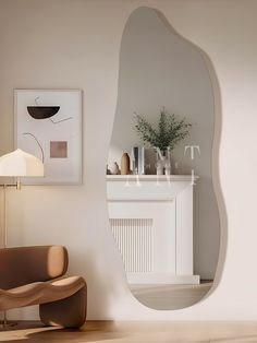 a living room with a large mirror on the wall next to a chair and lamp