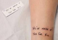 a person with a tattoo on their arm that says we've made it this far, ko