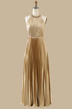 Indulge in elegance with our Gold Round Neck Ruffle Pleated Maxi Dress! Featuring a ruffled round neck and open back, this dress exudes sophistication and style. The pleated top and skirt add a touch of femininity, making it perfect for all your special occasions. Turn heads and feel confident in this stunning dress!
Product Details


SKU: MD0969
Polyester Fabric
Maxi Length
Size: US 0-16. Check our Size Chart to get your correct size. 
Recommend custom size for plus size.
Free custom size servi Chic A-line Pleated Dress With Ruffles, Elegant Cocktail Dress With Pleated Back, A-line Pleated Dress With Ruffles For Party, Satin Dress With Pleated Back For Date Night, Evening Satin Pleated Skirt Dresses, Evening Satin Dress With Pleated Skirt, Elegant Pleated Back Dress For Prom, Elegant Sleeveless Pleated Dress, Solid Pleated Prom Dress