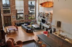 an aerial view of a living room, kitchen and dining area in a loft apartment