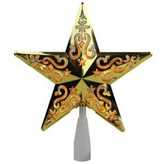 a decorative gold and black star on a white pole