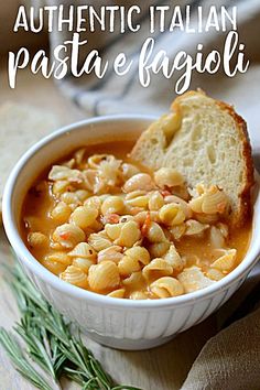 a white bowl filled with pasta and bread