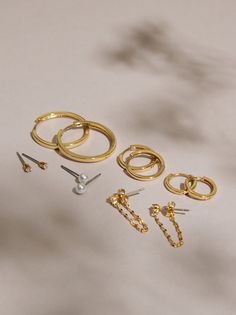 Add everyday staples to your jewelry collection with this variety pack featuring studs, hoops, and dangle earrings, all dipped in fine 18K gold. Jewelry Photography Styling, Photography Styling, Jewelry Photography, Gold Dipped, Variety Pack, Accessories Jewelry Earrings, Altar'd State, Gold Hoop, Earring Set