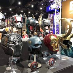 several different types of helmets on display at a convention