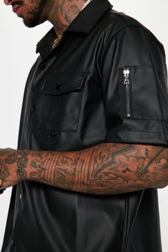 Available In Black. Short Sleeve Chest Pocket Functional Sleeve Pockets Snap Button Front 100% Polyester Coated With Polyurethane Imported | Mens Utility Faux Leather Short Sleeve Button Up Shirt in Black size 2XL by Fashion Nova Tall Height, Leather Short, Leather Shorts, Short Sleeve Button Up, Button Up Shirt, Model Height, Snap Button, Chest Pocket, Black Shirt