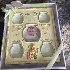 a baby's first birthday card in a plastic box with a ribbon around it