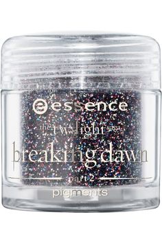 a jar of glitter in the shape of a jar with words on it and an open lid