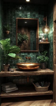 a bathroom with green tiles and a copper sink in the center, surrounded by potted plants