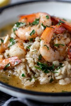 shrimp and rice with parsley in a white bowl