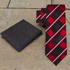 This silk necktie features a sophisticated geometric diamonds pattern in black and red, adding a bold and stylish element to your attire. Dress Shirts: Pair this necktie with dress shirts in solid colors such as: White Light gray Pale blue These colors complement the tie's black and red tones, allowing the geometric pattern to stand out sharply. A subtle stripe or small-scale pattern in coordinating colors can also enhance the tie's modern design. Suits: Opt for suits in classic colors like: Cha Geometric Diamond Pattern, Tie Matching, Scale Pattern, Tie Length, Color Complement, Geometric Diamond, Tie Colors, Silk Necktie, Coordinating Colors