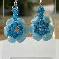 Blue, Carribean Blue, Lined With Blue Swarovski Crystals Fun! One Of My Favs! 1 1/2 Inch Earring. Hello, I Am Rita, A Master Bead-Weaver. I Have Kept My Work In The Family Until Now. Each Piece Is Carefully And Beautifully Hand Beaded. Light Blue Beaded Flower Jewelry, Light Blue Flower-shaped Beaded Jewelry, Blue Flower Charm Drop Earrings, Blue Beaded Flower Jewelry, Blue Flower-shaped Beaded Jewelry, Blue Flower Charm Earrings, Blue Flower Beaded Earrings For Gift, Blue Beaded Bohemian Flower Earrings, Blue Drop Flower Earrings With Ear Wire