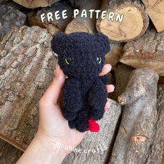 a hand holding a small stuffed animal in it's right hand with the words free pattern above it