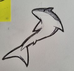 a drawing of a shark on a piece of paper