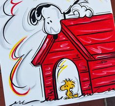 a drawing of a dog house with a snoopy on it's roof and a fire coming out of the chimney