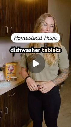 a woman is standing in the kitchen with her hands on her hips and there is an ad for dishwasher tablets