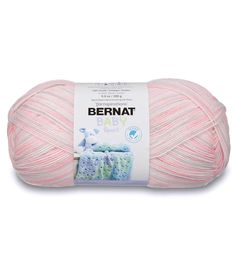 a ball of yarn that is pink and white