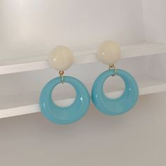 Crafted from durable acrylic with hypoallergenic 925 silver posts, these earrings are perfect for sensitive ears. The playful geometric design is available in four delightful colors: vibrant Green, soft Pink, bright Blue, and classic Cream. Lightweight and comfortable, these earrings are ideal for both everyday wear and special occasions. Slip them on and become the sweet, irresistible Candy Lady—who could resist? Trendy White Earrings, White Plastic Earrings For Parties, Trendy White Plastic Earrings, Trendy Light Blue Dangle Earrings, Trendy Light Blue Drop Earrings, Trendy White Resin Earrings, Chunky Pink Earrings, Pink Hypoallergenic Round Earrings, Modern White Resin Earrings