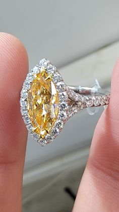 Beautiful Marquise Orange diamond set in a delicate Platinum ring with 0.62ct of rounds The diamond faces up predominantly orange Gia Certified Marquise Diamond Ring, Luxury Yellow Pear-shaped Ring, Yellow Platinum Diamond Ring Fine Jewelry, Yellow Diamond Platinum Ring With Center Stone, Yellow Platinum Diamond Ring, Fine Jewelry Yellow Diamond Platinum Ring, Pear-shaped Diamond Ring With Gemstone, Luxury Brilliant Cut Citrine Diamond Ring, Gia Certified Marquise Diamond Ring Fine Jewelry