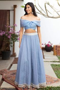 Aegean blue organza off shoulder choli with embroidered detail. Paired embroidered lehenga.
Components:2
Pattern:Embroidered
Type of Work:Thread work
Neckline:Off shoulder
Sleeve Length:Draped sleeves
Fabric:Tulle, Organza
Color:Blue
Other Details:
Twist knot choli
Scallop hem lehenga
Occasion:Wedding, Reception - Aza Fashions Butterfly Blouse Designs, Off Shoulder Choli, Organza Blouse Designs, Off Shoulder Lehenga, Tulle Lehenga, Organza Butterfly, Saree Jackets, Aegean Blue, Lehnga Dress