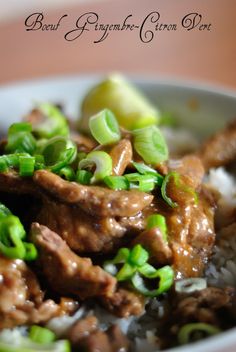 a white bowl filled with meat and rice