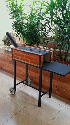 a small table with wheels on it in front of some plants