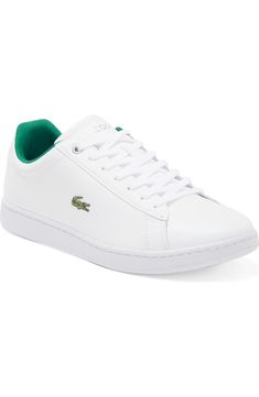 Classic Sneakers With Logo, Classic White Tennis Sneakers, Classic Sneakers With Logo And Round Toe, Classic Tennis Sneakers With Cushioned Footbed, Classic Cushioned Tennis Sneakers, Casual Green Sneakers With Embossed Logo, Classic Tennis Sneakers With Round Toe, Classic Green Low-top Sneakers, Classic Low-top Synthetic Skate Shoes