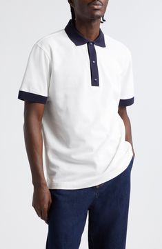 A tricolor logo patch authenticates this cotton-piqué polo framed in contrast trim. Button half-placket Spread collar Short sleeves 100% cotton Dry clean Imported Designer Clothing Moncler Logo, Contrast Trim, Tri Color, Patch Logo, Clothing Items, Designer Clothing, Tennis, Top Brands, Dry Clean