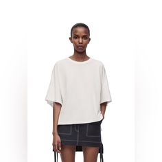 Loewe T-Shirt Colour: White Boxy Fit T-Shirt In Lightweight Cotton Jersey. Oversized Fit Short Length Crew Neck Asymmetric Front To Back Side Slits Anagram Embroidery Placed On The Chest Modern Oversized T-shirt, Boxy Drop Shoulder Summer Tops, Boxy Drop Shoulder Tops For Summer, Chic Oversized Crew Neck T-shirt, Chic Boxy Fit Crew Neck Top, Chic Oversized Short Sleeve T-shirt, Black Silk Top, Blue Denim Shirt, Sparkle Sweater