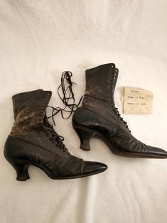 "Wonderful note with these boots - worn by Mom in 1913. Authentic Victorian era lace up boots, condition okay - with wear and age but still intact with integrity. Label is Physical Culture Shoes For Style and Ease Em Henne Co. Brooklyn N.Y.. Sold at M Myers & Son New Haven. See photos for wear - worst area back of the right boot where there is a loss of surface and some small tears to leather. Not tiny in size, footbed from the outside 10 3/4\", 2 3/4\" wide, heel height 2.5\" shaft height 9 Historical Formal Boots With Round Toe, Historical Round Toe Boots For Formal Occasions, Historical Round Toe Formal Boots, Vintage Lace-up Boots With Leather Sole For Formal Occasions, Vintage Lace-up Boots With Pointed Toe And Leather Sole, Vintage Fitted Boots With Laces, Vintage Formal Boots With Laces, Vintage Lace-up Boots For Formal Occasions, Vintage Brown High Heel Lace-up Boots