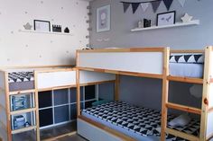 there is a bunk bed in the room with two sets of drawers on each side